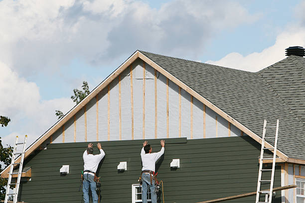 Professional Vinyl Siding technician working in Westwood, MA